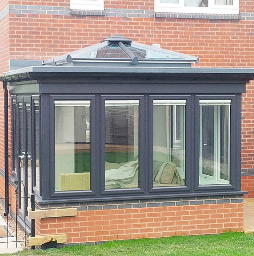 Orangery with grey framed windows and French doors